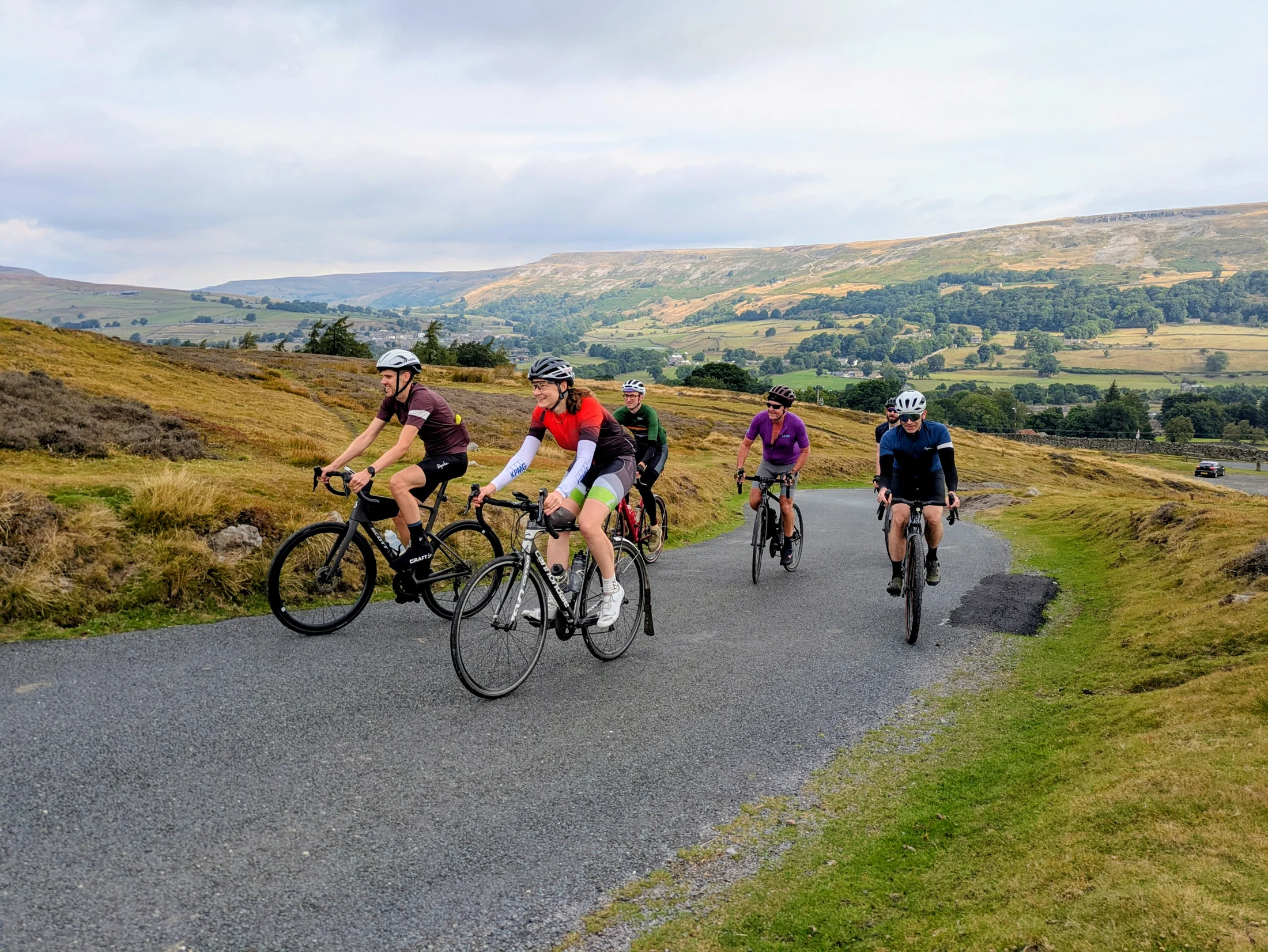 Out Velo riders cycling through the Yorkshire Dales